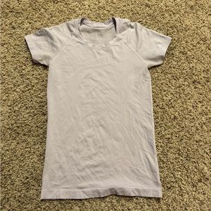 Lululemon swiftly tech short sleeve shirt size 6. Color is a lavender purple.